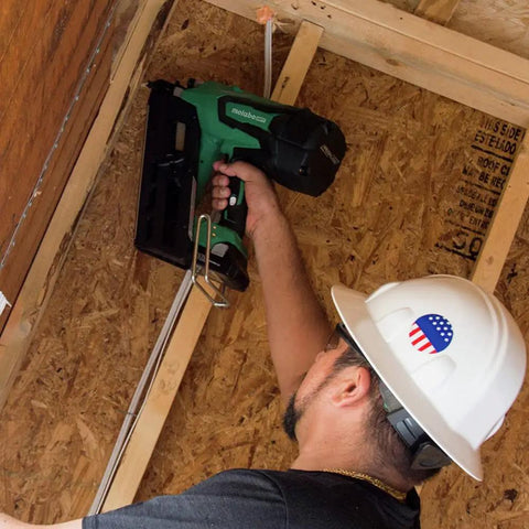 Worker using 18V MultiVolt Cordless Framing Nailer Kit with 30-Degree Magazine for construction