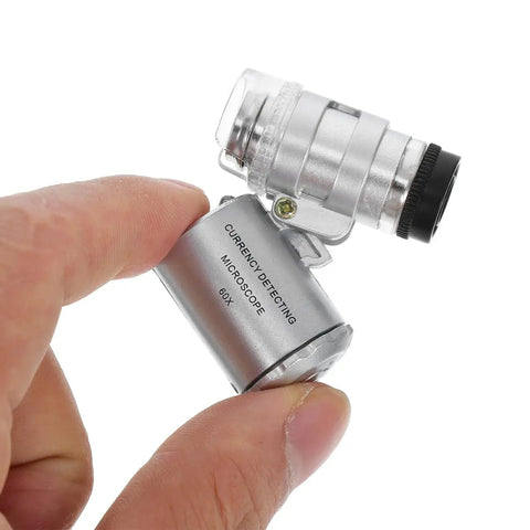 Close-up of 60x Pocket Microscope With LED Light For Jewelry And Currency Inspection Ultra Compact Magnifier For Gemstones And Coins On The Go