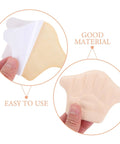 Game Changing Heel Grips And Liner Cushions To Tighten Up Loose Shoes Anti Chafing Beige Shoe Inserts in hand showing adhesive side.