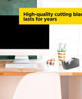 Deluxe Black Desktop Tape Dispenser With Weighted Non Skid Base on desk beside computer and stationery
