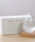 Storm Glass Weather Predictor With Wood Base Modern Weather Station Crystal Glass Bottle For Home Or Office Decor Predict Weather By Crystal Formations Dope Desk Accessory And Conversation Starter on a wooden surface