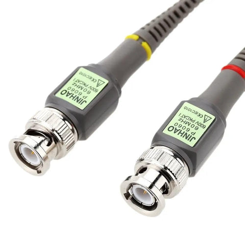 Close-up of 60MHz Oscilloscope Probe Kit With X1 And X10 Attenuation Switch connectors, showing metallic ends and labeled gray cables.