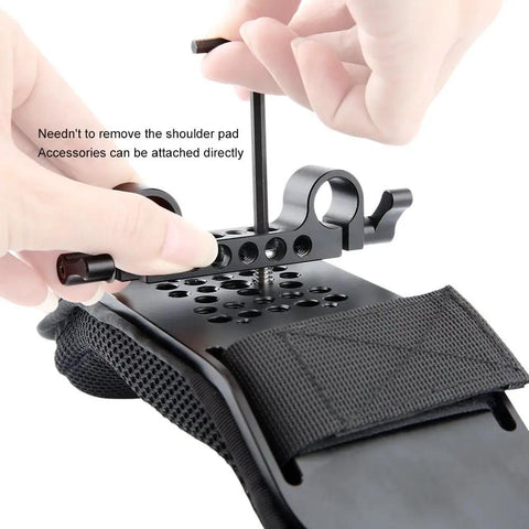 Close-up of a Steady Shoulder Mount And Pad For DSLR Camcorders And DV Cameras With 15mm Rail System being assembled, showing railblock