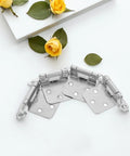 Set Of Four Spring Loaded Cabinet Hinges Self Closing Heavy Duty Iron Hardware For Kitchen Cabinets And Furniture Fade Resistant Multi Fold Doors Smooth Door Movement Easy Install on white background with yellow roses