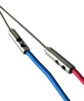 Stainless steel wire grip for heavy duty pulling, with blue and red cables connected for electricians' use.