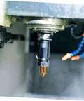 Installed UKCOCO flute steel chamfering cutter in a milling spindle; gold-colored bifurcated tip, black shank