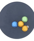 Top view of a Magnetic Welding Fixture with Iron Plate and Strong Holding Magnet, featuring colorful magnets on a circular black surface