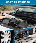 Grease Monkey Ready Manual Fluid Extractor Pump With Three Extension Hoses For Brake Fluid Swap And Gear Oil Transfer in use under hood.