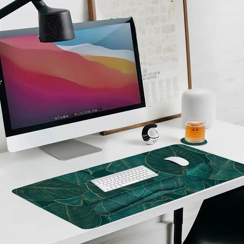 Ergonomic Large Mouse Pad And Keyboard Wrist Rest Dope Desk Pad For Keyboard And Mouse 4 In 1 Extended Gaming Desk Mat With Wrist Support For Home Office Study Green Leaves on a desk with a keyboard and mouse