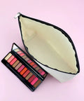 Open Im Not Lost Geocaching Gift Makeup Bag For Women with a makeup palette on pink background