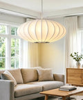 AFSEMOS 20" Japanese Wabi Sabi Pendant Light Silk Hanging Lantern Lamp illuminating a cozy living room setting.
