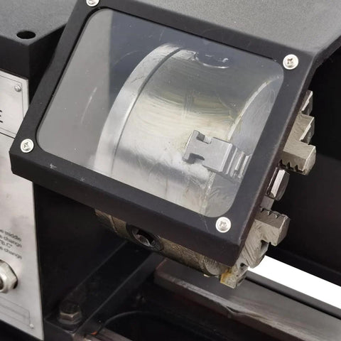 Bench metal lathe with geared head, front view showing protective clear cover over headstock gears.