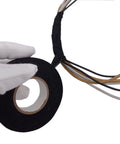 Gloved hand holding Heavy Duty Cloth Electrical Tape For Automotive And Home Use DIY Friendly High Temperature Friction Tape Black