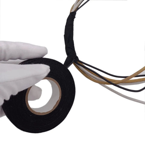 Gloved hand holding Heavy Duty Cloth Electrical Tape For Automotive And Home Use DIY Friendly High Temperature Friction Tape Black
