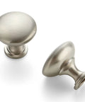 Slick Brushed Nickel Round Zinc Cabinet Knobs Delivering Fresh Euro Style Vibes For Modern Kitchen Or Bathroom Setups Sweet Smooth Finish In Top Shelf Twenty Piece Pack Ready For Fast Upgrades. Two brushed nickel cabinet knobs shown at different angles.