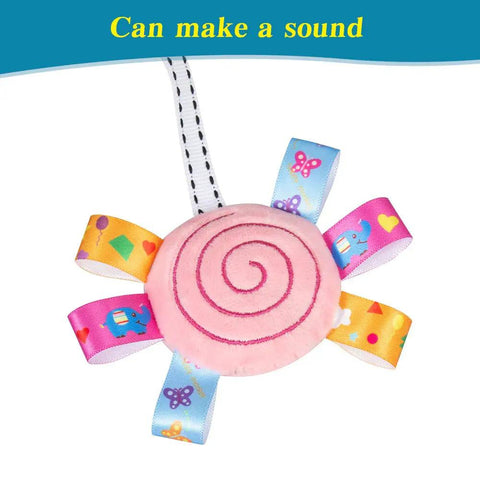 Travel Arch Bassinet Toy Clip On Stroller Toy with pink squeaky plush spiral detail for infants and toddlers.