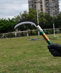 Heavy Duty Weeding Sickle With Manganese Steel Blade And Hardwood Handle Serrated Grass Hook Cutter in use, outdoor setting