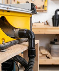 Heavy Duty DeWalt 7492 Table Saw Dust Collection Adapter With Adjustable Diameter Port and 90 Degree Elbow connected to a table saw.