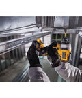 Person using Atomic 20V Max Cordless Impact Driver Kit With Two Batteries And One Quarter Inch Hex Chuck Ultra Compact Five Point One Inch Length for tight space