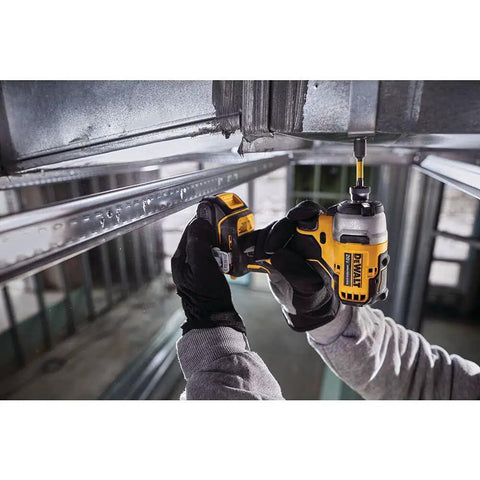 Person using Atomic 20V Max Cordless Impact Driver Kit With Two Batteries And One Quarter Inch Hex Chuck Ultra Compact Five Point One Inch Length for tight space