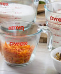 Three Piece Glass Measuring Cups Set With 1 Cup 2 Cup And 4 Cup Sizes For Prep Bake And Cook filled with ingredients