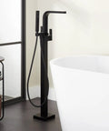 Hibiscus Straight Up Modern Freestanding Tub Faucet Forged From Solid Brass Featuring Integrated Hand Shower On Flex Hose for sleek bathroom design.