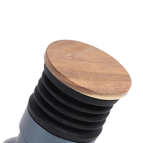 Crush Your Daily Brew Routine With This Straight Fire Manual Coffee Grinder featuring a rich walnut wood lid and silicone blower.