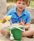 Child using Mini Colorful Metal Hand Shovels Set 10 Pack Garden Trowels For Kids Teens And Adults Perfect For Flower Soil Planting Digging Transplanting