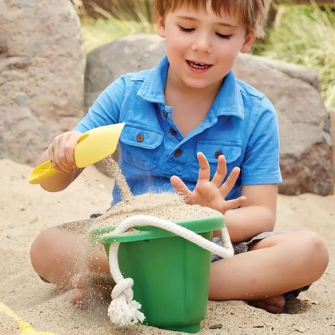 Child using Mini Colorful Metal Hand Shovels Set 10 Pack Garden Trowels For Kids Teens And Adults Perfect For Flower Soil Planting Digging Transplanting