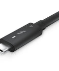 Close-up of Modular Thunderbolt Dock Delivering Solid Ninety Watt Punch Alongside Flexible HDMI DisplayPort Ethernet Cables.