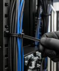 Heavy Duty Self Locking Nylon Cable Ties In Black securing blue and black cables on a rack, ideal for cable management and wiring.