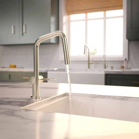 hansgrohe Talis N Pull Down Kitchen Faucet, Modern, Magnetic Hand Sprayer, 1-Handle, 1.75 GPM, Polished Nickel pouring water into a white sink.