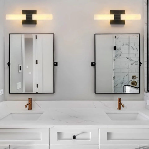 Set Of Two Dope Matte Black Wall Sconces With Frosted Glass Shades above a double bathroom vanity