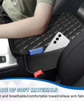 Pro Grade Diamond Quilted Armrest Pad For Tesla Cybertruck 2024 Through 2026 on console with phone, showcasing soft memory foam.