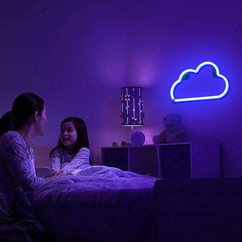 Mother and daughter in bedroom with blue cloud neon sign on wall, soft glow creating relaxing atmosphere, focus on family time.
