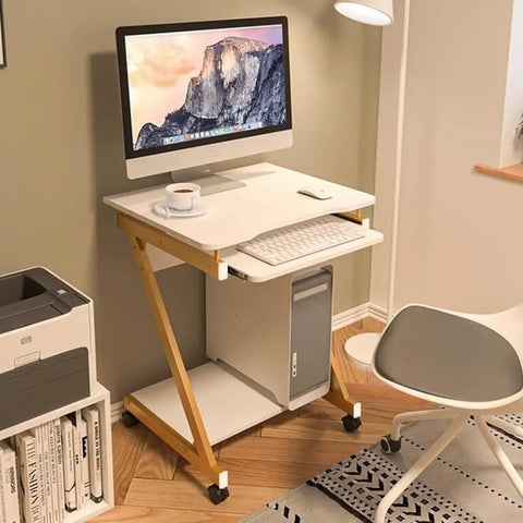 Adjustable Height Black Standing Desk With Pull Out Keyboard Tray And Compact Storage Shelf Portable Laptop Workstation in home office setup.