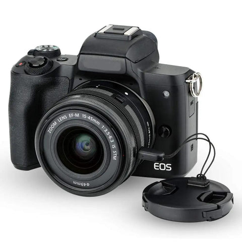 Camera with lens and attached Two-Pack 49mm Front Lens Cap With Keeper For Canon R100 R50 R10 And RF-S Kit Lenses EF 50mm f1.8 RF-S 10-18mm f4.5-6.3 STM Sony 49mm Lenses Center-Pinch Cap Design Keeps Your Lens Safe And Prevents Cap Loss.