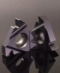 Pro Grade 20 Piece Carbide Threading Insert Set With 16Er And 16Ir Ag60 Geometry on reflective surface, showcasing cutting edges.