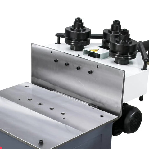 Close-up of Tough Three Roll Hydraulic Metal Bender That Knocks Out Flat Stock And Square Tubes Without A Sweat showing rollers and control panel.