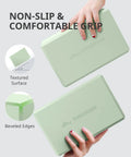 Two Premium Soft Foam Yoga Blocks For Pilates And Meditation Lightweight Odorless Cushioned Supports in mint green with textured surface.