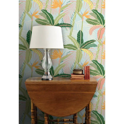 Tropical Botanical Vinyl Wallpaper Featuring Subtle Leather Texture Built Different Heavy Duty Commercial Grade Finish Custom Printed Paste Required with lamp and wooden table.