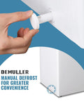 User adjusting manual defrost feature on No Sweat Compact Chest Freezer With Dual Removable Baskets And Precision Digital Display To Keep Your Grocery Stash Rock Solid Cold In White Finish Quick Freeze Unit.