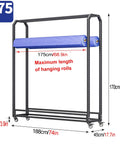 Rock Solid Commercial Fabric Roll Storage Rack Featuring Adjustable Hanging Bars For Wallpaper Linen Setup Plus Hella Sturdy Steel Frame Top Tier Workshop Organizer with two blue fabric rolls.