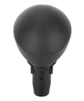 Upgrade Your Ride With This Sleek Tertioi Gear Shift Knob And Lever For Smooth Manual Or Auto Transmissions. Features Anti Skid Grip, Easy Install Kit, And Wrap Tape For A Custom Look That Keeps Your Drive Cool And Comfortable While You Cruise The. Black ABS rubber gear shift knob with anti-skid grip and lever base, front view