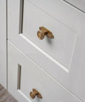 Top Notch Heavy Duty Solid Zinc Cabinet Knobs With Vintage Oval Beaded Back Plates Antique Brass Finish Six Pack displayed on white drawers.