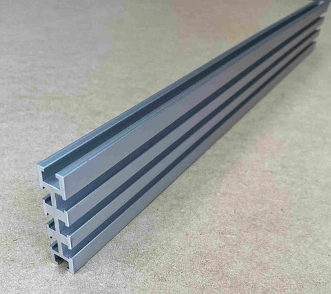 Heavy Duty 94 Inch Aluminum Multi T Track With Eight Precision Slots For Custom Jigs And Workbenches Plug And Play Build Premium 6061 T6 Anodized Made In USA, viewed from the side.