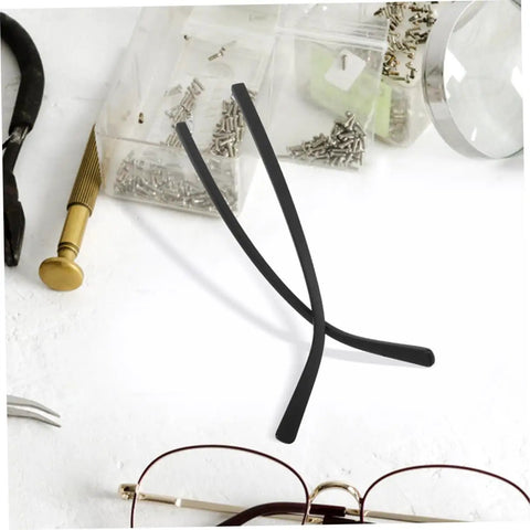 Two Pairs Metal Eyeglass Temple Replacement Arms Kit For Fast Easy Repairs shown with tools on a white surface