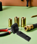 Forklift Hood Hinge Kit For Industrial Engines with tools and brass fittings on green surface