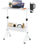 Mobile Standing Desk With Wheels, Height Adjustable From 28.3 To 46.3 Inches, featuring a white rolling laptop cart with storage.