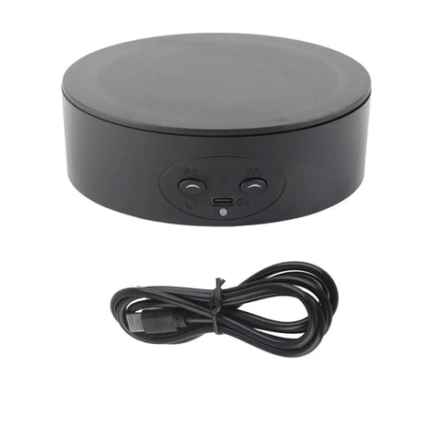 Smooth And Silent 360 Degree Rotating Display Stand with USB cable, black ABS base for showcasing products.